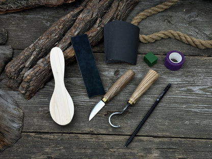 Spoon Carving Kit with knives, wooden blank, sandpaper, sharpening board, pencil, and finger wrap