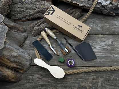 Spoon carving kit with sharpened tools, wooden blank, sandpaper, sharpening board, pencil, and finger wrap