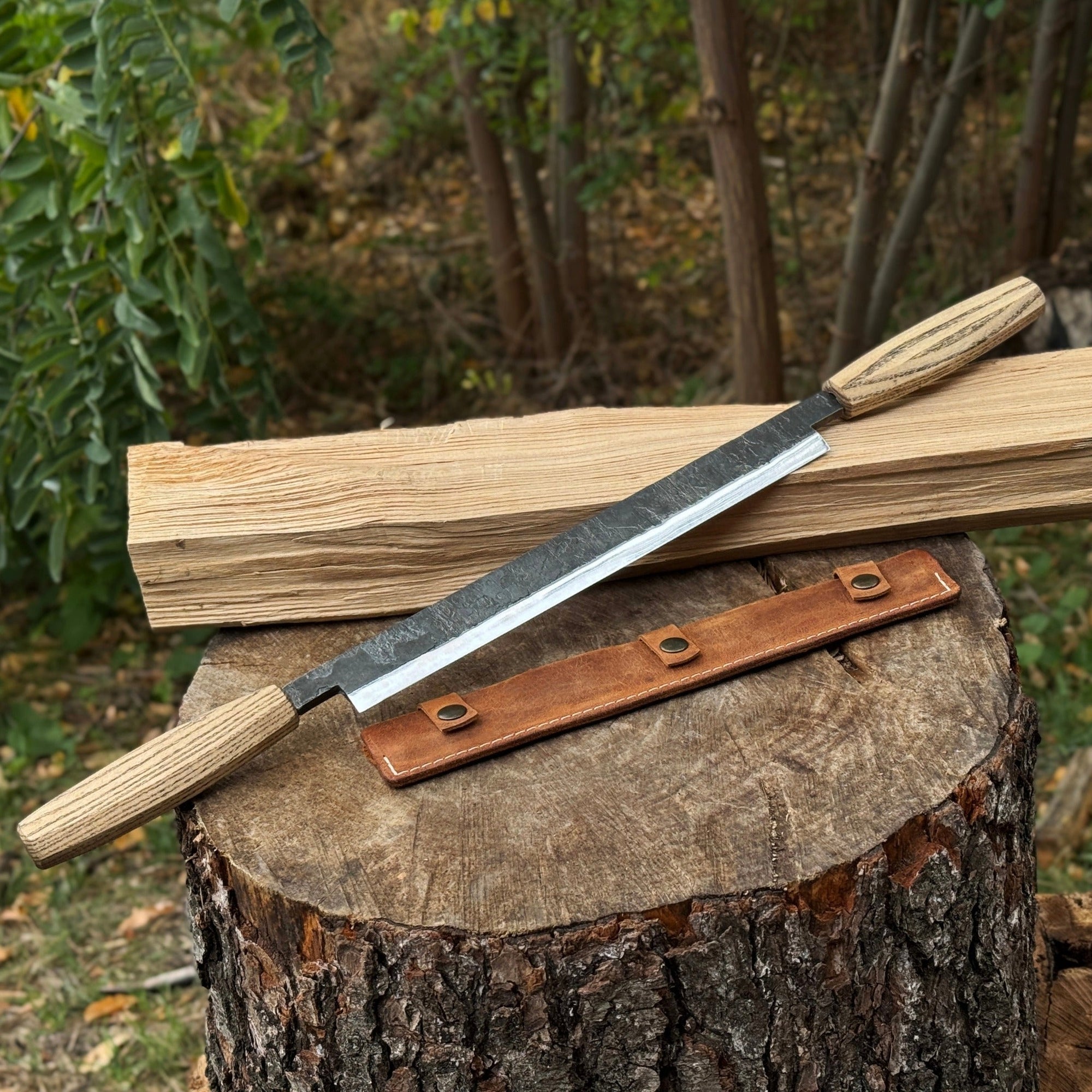 Straight drawknife with 25 cm carbon steel blade and leather sheath