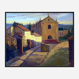 Painting of a sunlit cobblestone path with yellow buildings and a church with spires, set under a soft, cloudy sky at dusk.