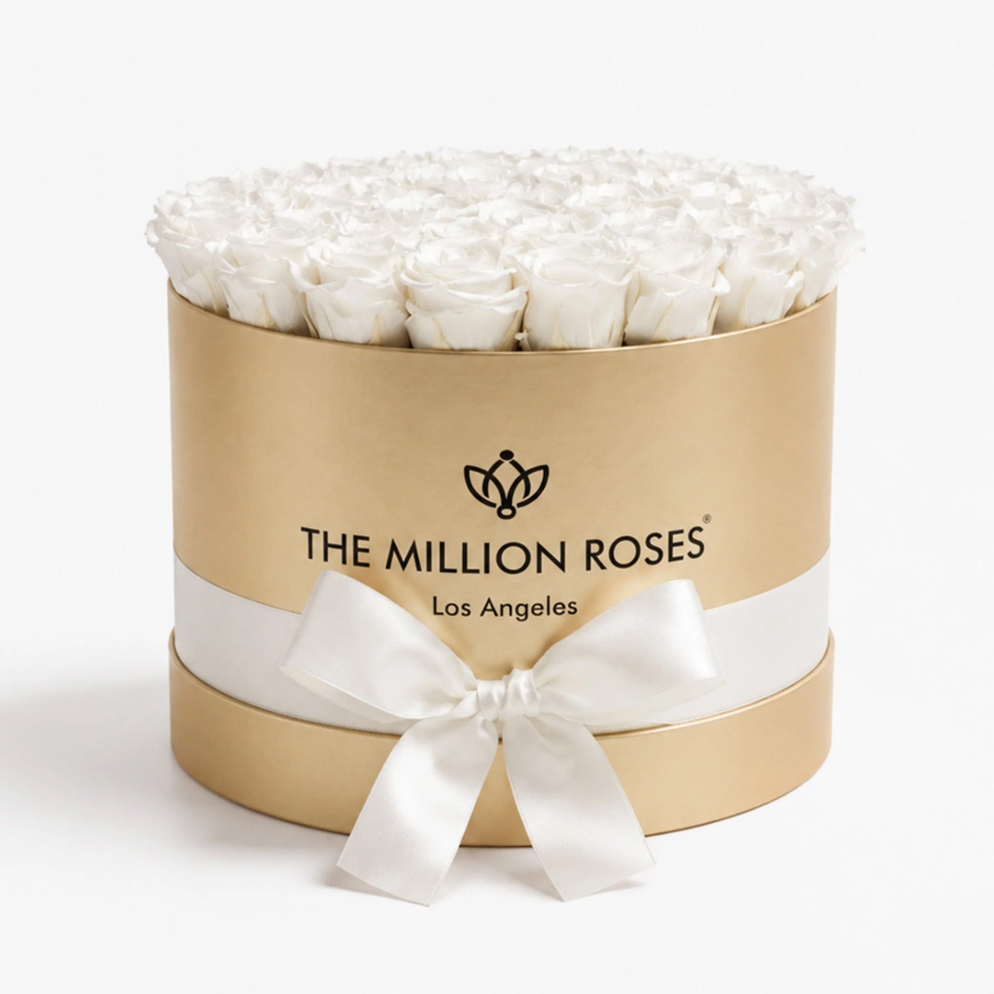 Supreme Gold Box containing 26-28 white preserved roses arranged neatly, showing a close-up of the gold box and white roses