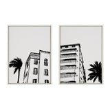 Black and white sketch-style prints of two Miami Beach Art Deco buildings with palm trees, each framed and shown against a white background.