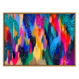Abstract painting with vibrant brushstrokes in blues, pinks, oranges, and greens, accented with white dots and wavy black lines on a gold background, framed in light wood.