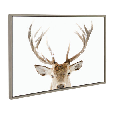 Sylvie Stag Peekaboo Framed Canvas depicting a deer in snowy forest setting