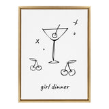 Minimalist black line drawing of a martini glass with an olive and two cherry pairs below, captioned 'girl dinner' in lowercase script, framed in light wood.