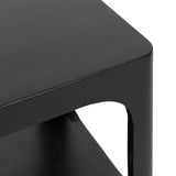 Close-up of a black side table corner with curved edges and a cutout detail on the supporting side panel, showing smooth matte finish.