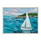 Painting of a white sailboat on vibrant blue water near a green, tree-covered shoreline under a sky with pink and blue clouds, framed in white.