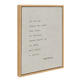 Framed canvas with a typewritten Ralph Waldo Emerson quote in black text on a light gray background, enclosed in a simple light wood frame, shown at an angle.