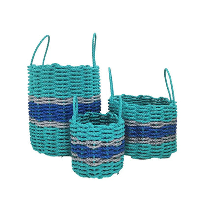 Handmade storage basket woven from teal and blue Maine lobster rope with light gray accents
