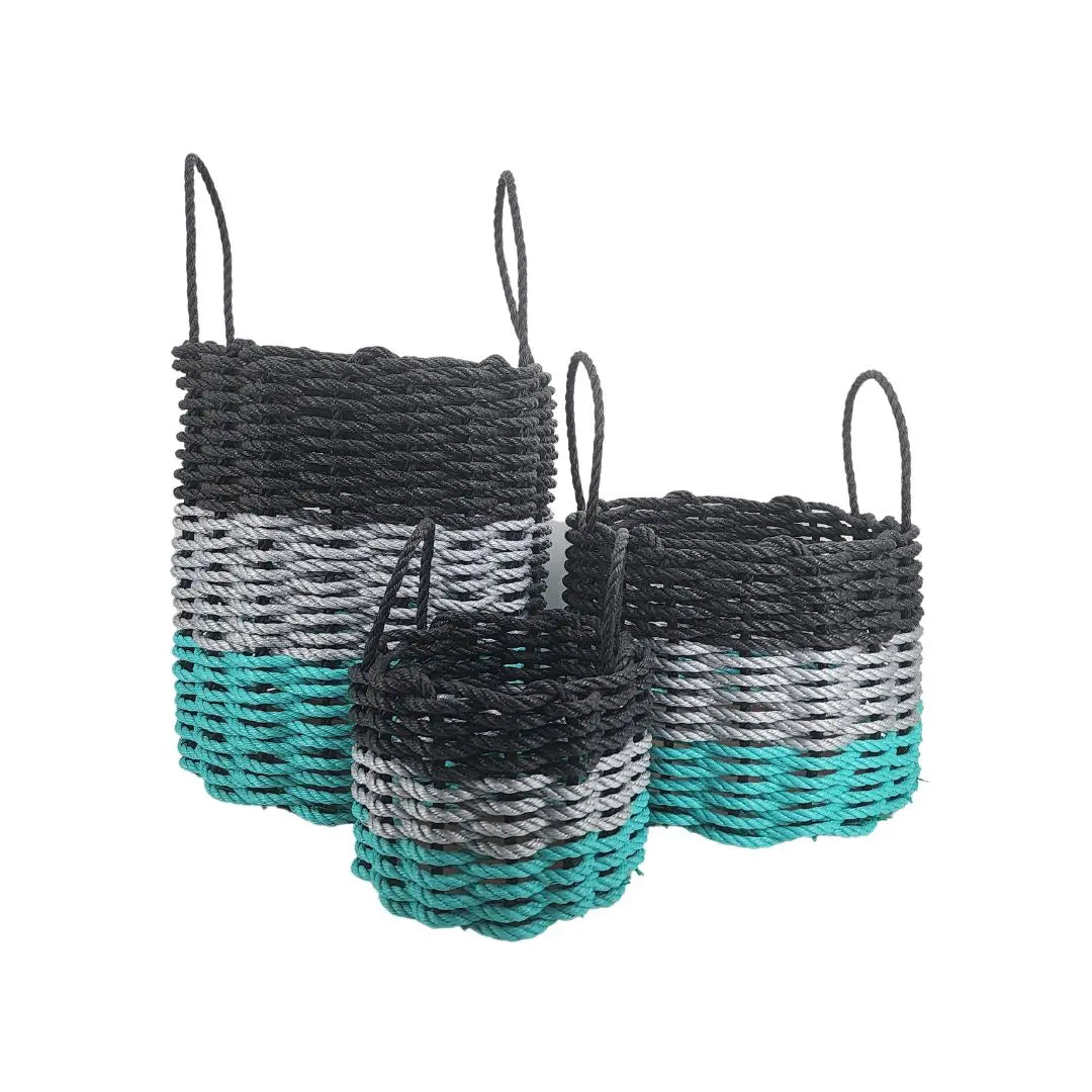 Handmade storage basket woven from Maine lobster rope in teal, gray, and black colors