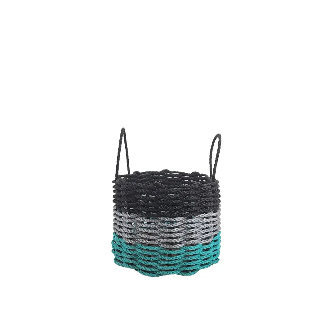 Handmade storage basket woven from Maine lobster rope in teal, gray, and black colors