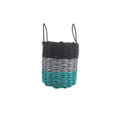 Handmade storage basket woven from Maine lobster rope in teal, gray, and black colors