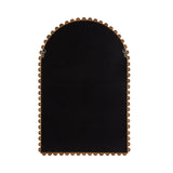 Arched wall mirror with a dark reflective surface and a scalloped wooden frame surrounding its rounded top and straight bottom edges.