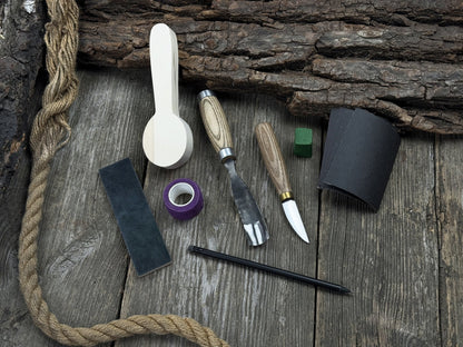 The Perfect Spoon Carving Kit for Beginners with tools, wooden blank, sandpaper, and sharpening board