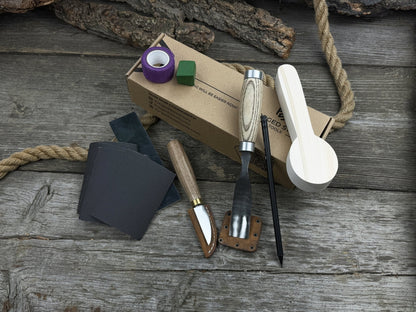 The Perfect Spoon Carving Kit for Beginners with tools, wooden blank, sandpaper, and sharpening board