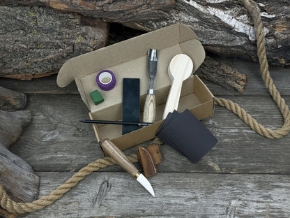 The Perfect Spoon Carving Kit for Beginners with tools, wooden blank, sandpaper, and sharpening board