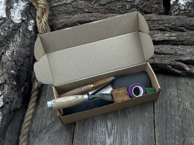 The Ultimate Beginner’s Spoon Carving Kit with tools, wooden blank, sandpaper, and sharpening board