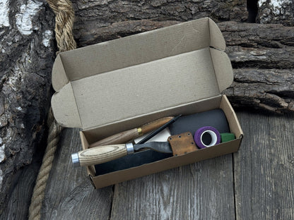 The Ultimate Beginner’s Spoon Carving Kit with tools, wooden blank, sandpaper, and sharpening board