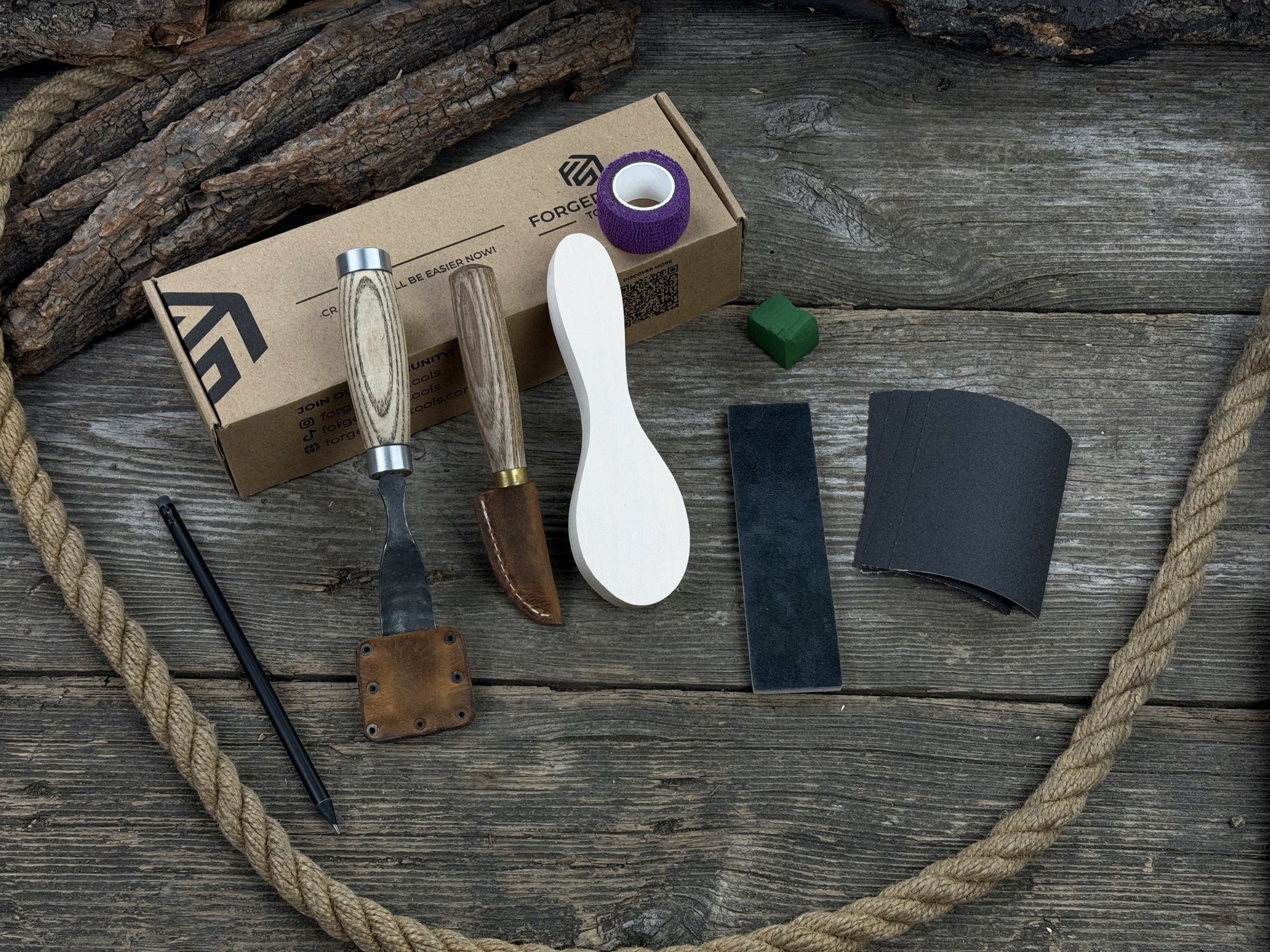 The Ultimate Beginner’s Spoon Carving Kit with tools, wooden blank, sandpaper, and sharpening board