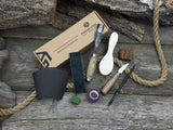 The Ultimate Beginner’s Spoon Carving Kit with tools, wooden blank, sandpaper, and sharpening board