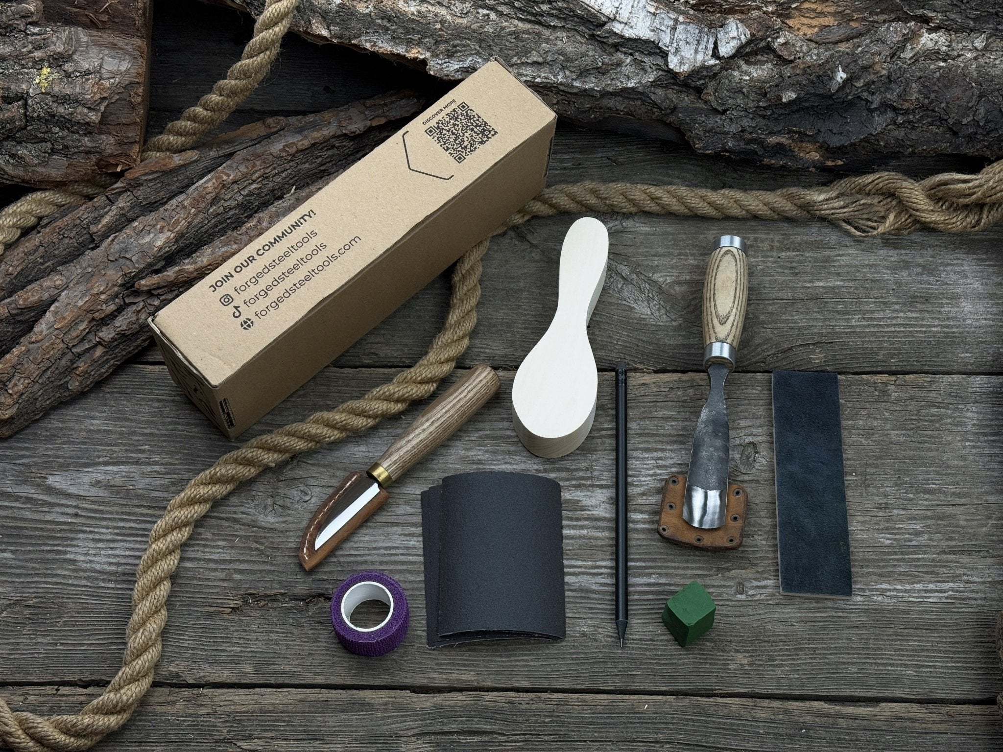 The Ultimate Beginner’s Spoon Carving Kit with tools, wooden blank, sandpaper, and sharpening board