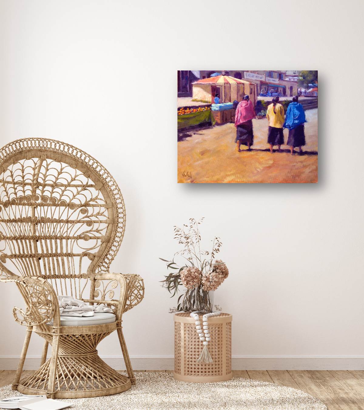 Canvas print showing three women walking away on a sunlit street, dressed in colorful jackets with market stalls in the background.
