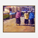 Painting of three women walking on a sunlit street, wearing colorful shawls—pink, yellow, and blue—with market stalls and buildings in the background.