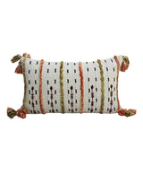 Rectangular handwoven throw pillow with vertical stripes in terracotta, olive green, and black on white fabric, featuring tassels at all four corners.