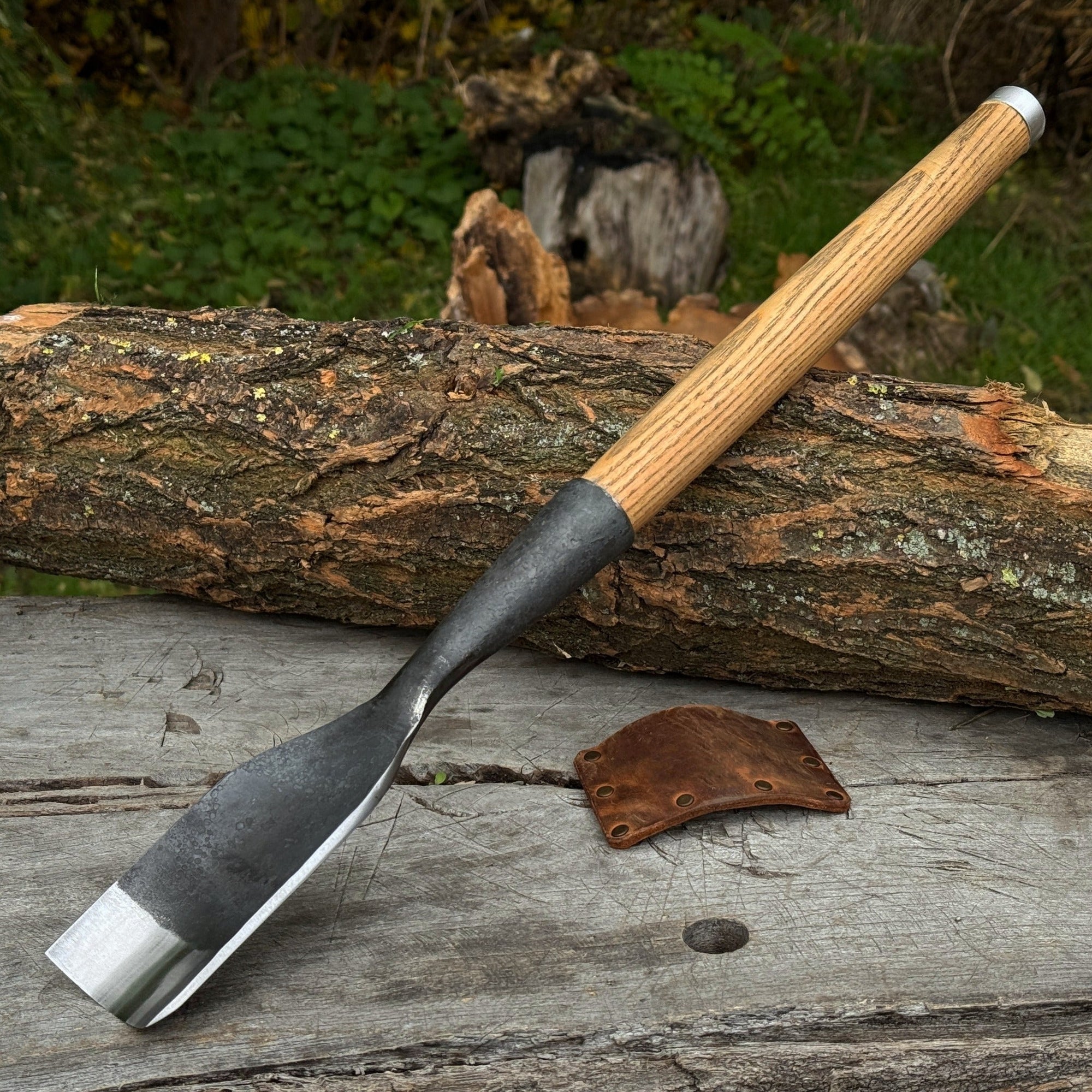 Hand-forged timber framing rounded chisel with ash handle and steel blade