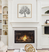 Black and white tree illustration on textured linen canvas framed in thin wood above a lit fireplace, flanked by built-in white shelves with decorative items.