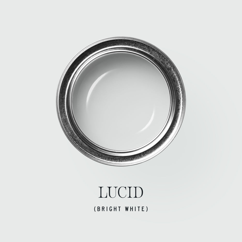 Cans of Lucid white paint by tonesterpaints in various finishes, shown in studio setting