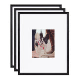 Set of three black beaded photo frames with white mats displaying a picture of a small black and white dog wearing a pink collar in an outdoor setting.