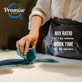 Person in a white shirt and dark apron pouring blue epoxy resin from a small cup onto a white surface, demonstrating mixing and working time instructions.
