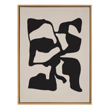 Abstract canvas artwork with irregular black shapes on a tan background, framed in light wood, titled 'Sylvie Distorted Shapes of Black and Tan' by The Creative Bunch Studio.