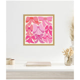 Framed canvas artwork featuring six stylized bows in varying shades of red and pink arranged in two rows on a white background, hanging above a minimalist white shelf.