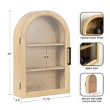 Arch-shaped wall cabinet in natural wood finish with two shelves behind a glass door, featuring a black handle and 24-inch height.