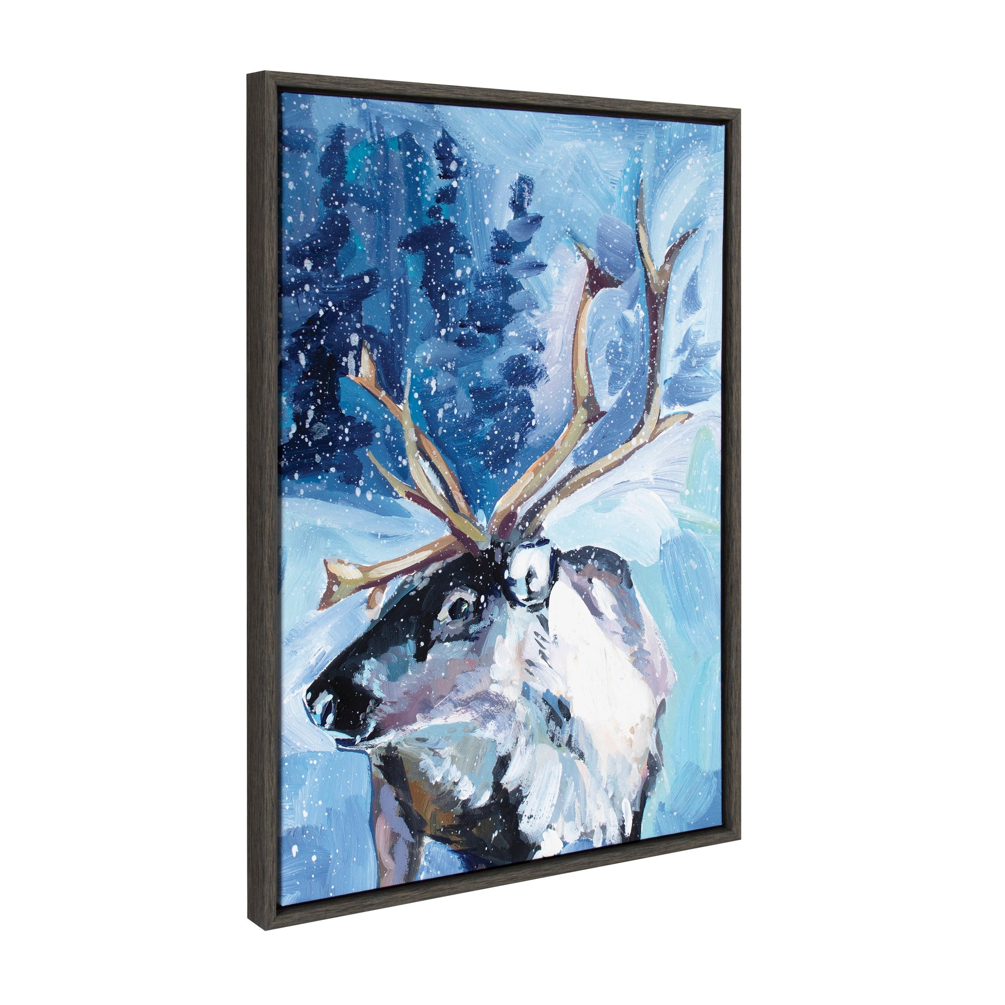 Sylvie Reindeer In Snow framed canvas art showing a reindeer standing in snow with modern dark gray lightweight frame