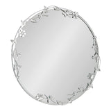 Round wall mirror with a thin silver frame adorned with delicate three-dimensional floral and butterfly accents evenly spaced around the edge.