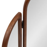 Close-up of two adjacent panels of a tri-fold mirror with smooth, rounded walnut wood frames and a visible black metal hinge connecting them.
