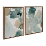 Set of two abstract watercolor canvas artworks by Amy Lighthall featuring blended teal, blue, and beige shapes in thin brown frames, shown from an angled view.