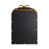 Tall rectangular mirror with arched top and a golden frame accented by a decorative ribbon-like bow at the top center against a white background.