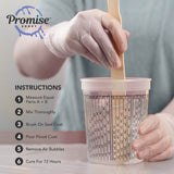 Hands wearing gloves stir epoxy resin in marked clear mixing cup with wooden stick showing measurement scales and usage instructions printed beside.