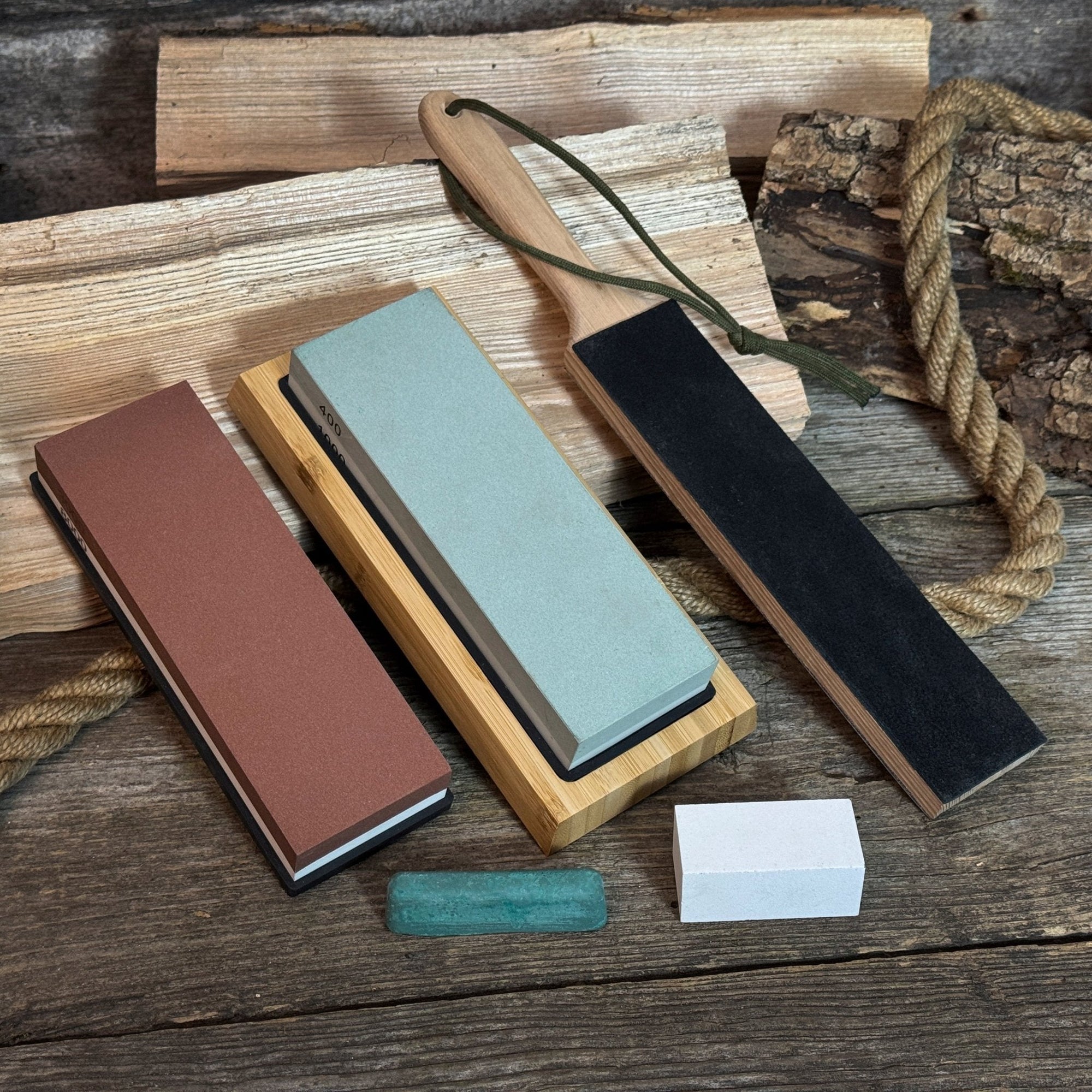 Universal Sharpening Kit including sharpening stones, leather strop, polishing compound, and wooden stand