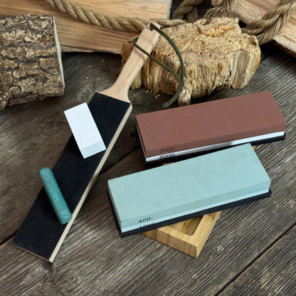 Universal Sharpening Kit including sharpening stones, leather strop, polishing compound, and wooden stand