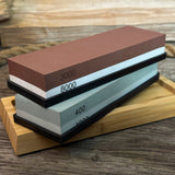 Universal Sharpening Kit including sharpening stones, leather strop, polishing compound, and wooden stand