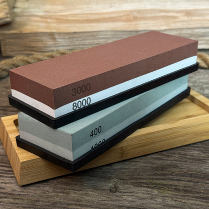 Universal Sharpening Kit including sharpening stones, leather strop, polishing compound, and wooden stand