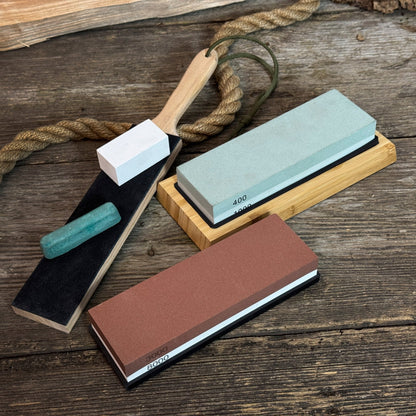 Universal Sharpening Kit including sharpening stones, leather strop, polishing compound, and wooden stand