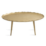 Oval coffee table with a textured, wavy gold surface and three slender gold legs, shown against a white background.
