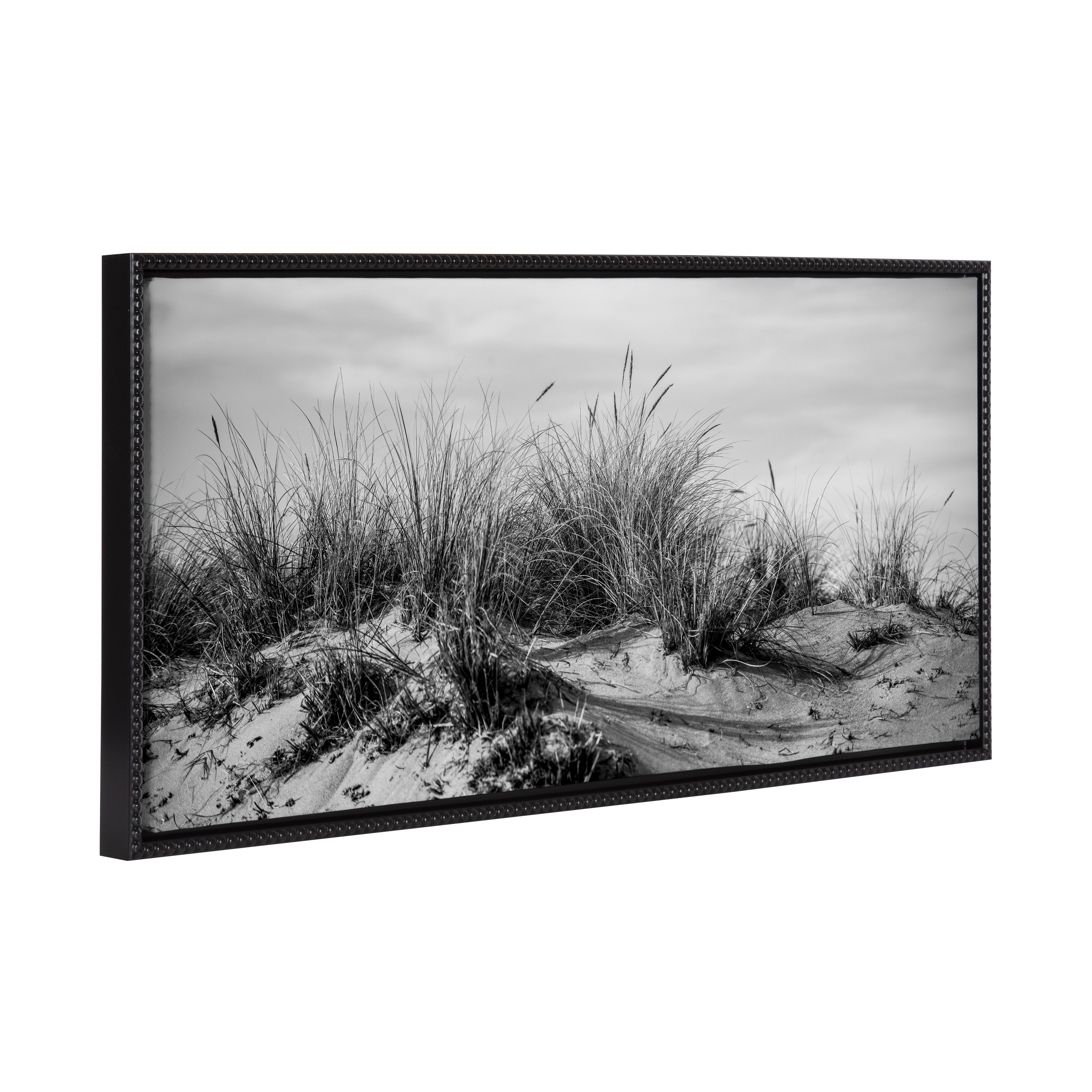 Black and white framed canvas art depicting a coastal view with vintage beaded frame