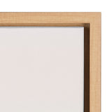 Close-up of a corner of a light beige canvas tightly stretched inside a natural wood frame with mitered edges, showing subtle fabric texture and wood grain.